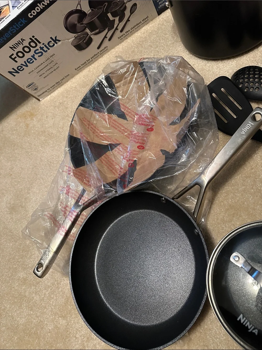 Ninja cookware set in black and stainless steel with glass lid